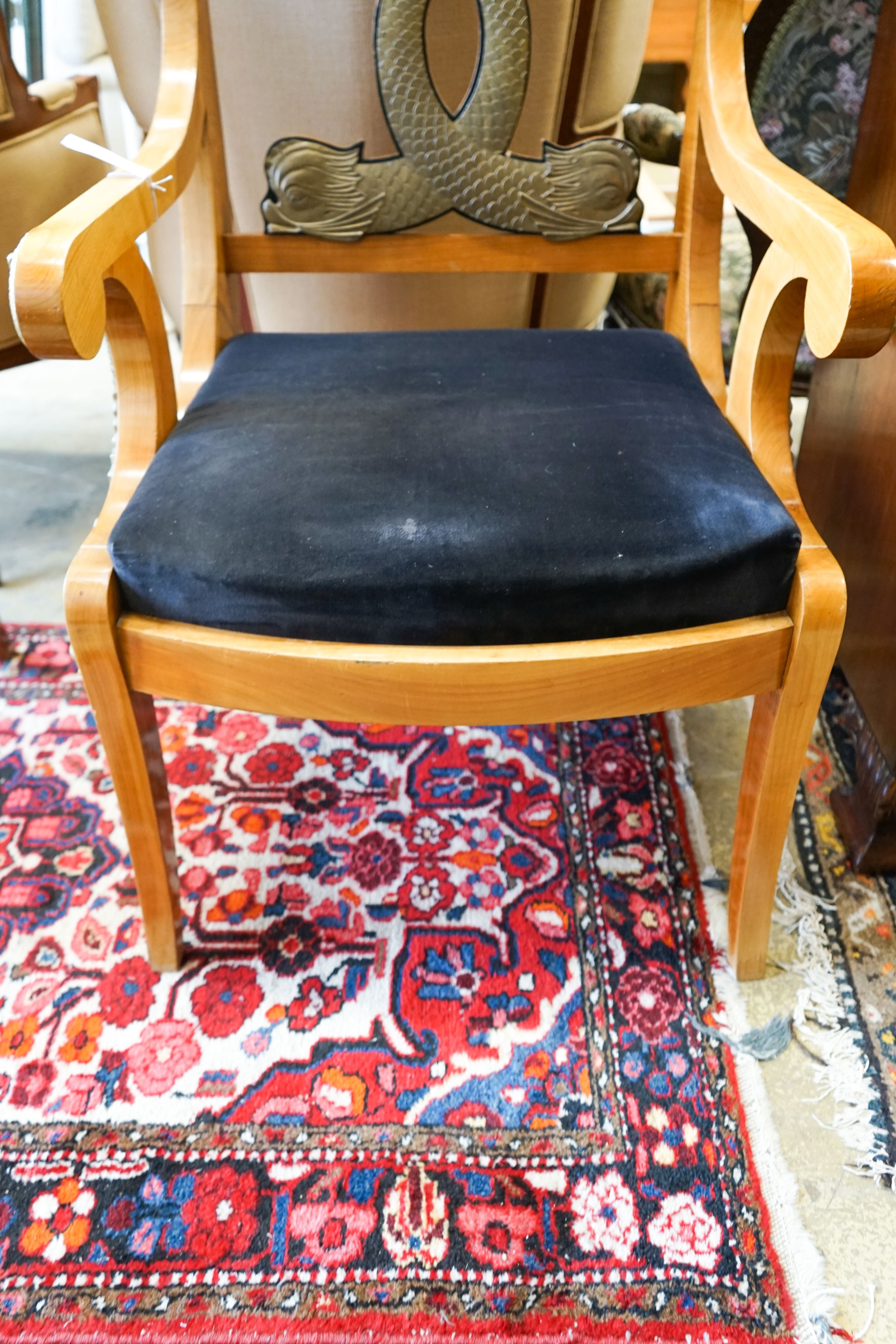 A pair of Empire style cherry elbow chairs with gilt metal dolphin mounts, width 65cm, depth 56cm, height 107cm